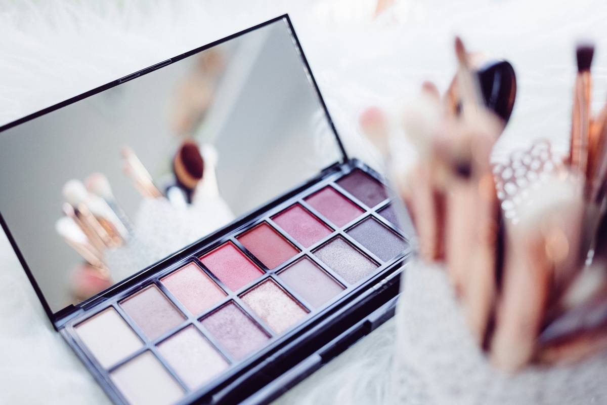 Model showing fresh makeup finish with glowing skin and minimal product